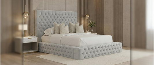 Modern king size bed with tufted upholstered headboard and padded base in a contemporary bedroom interior.