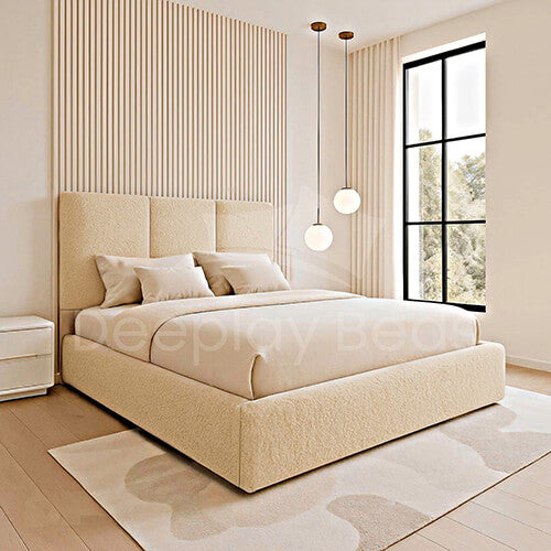 Beige bedroom with a large bed, striped wall, and large window.