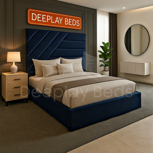 Modern bedroom with a blue upholstered bed and 'DEEPLAY BEDS' branding.