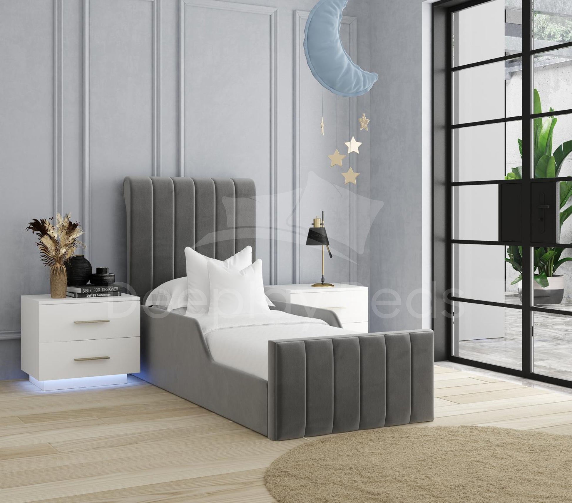 Gray upholstered bed in a modern bedroom with white walls and decorative elements.