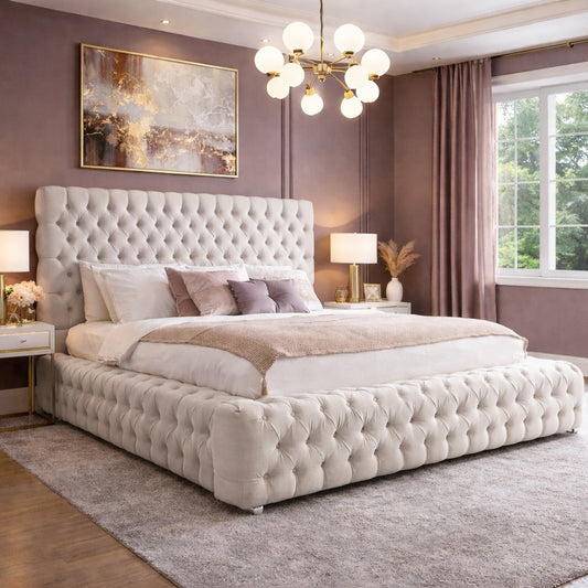 Luxurious bedroom with a tufted bed, decorative pillows, and a chandelier.