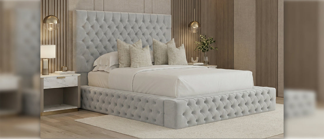 Grey fabric bed frame with tufted headboard and upholstered base in modern bedroom