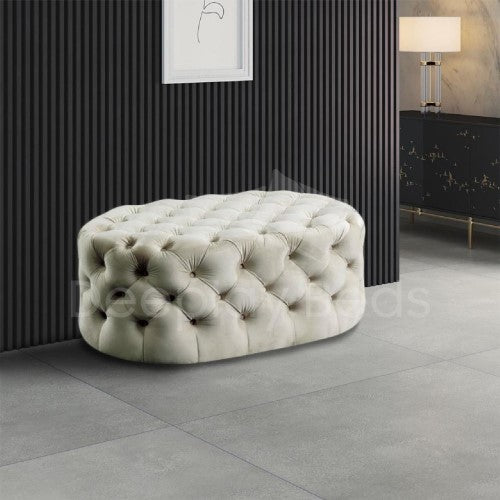 Decorative ottoman with tufted design in a modern interior setting