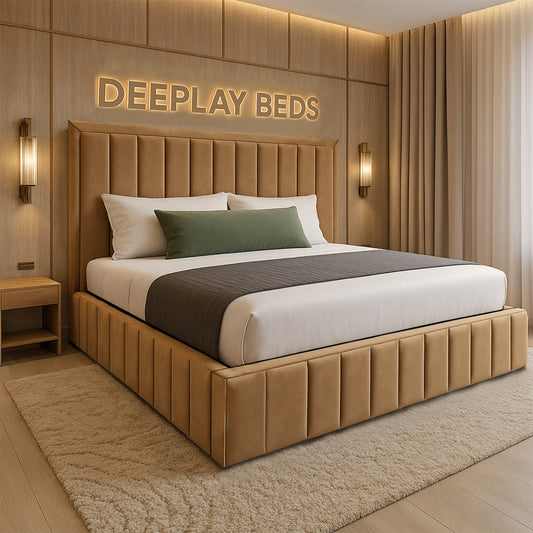 Beige upholstered bed with pillows in a room with 'DEEPLAY BEDS' branding.