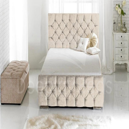 Beige tufted bed with matching ottoman in a bright bedroom setting