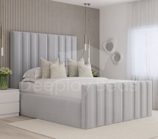 Modern bedroom with a gray upholstered bed and decorative pillows.