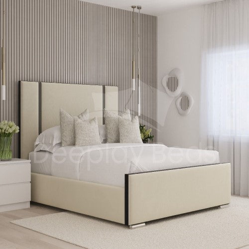 Modern bedroom with a beige bed and decorative pillows.