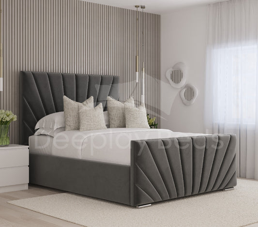 Sunrise Grey Velvet Ottoman Storage Bed featuring a tall panel headboard with elegant tufted detailing, set in a modern bedroom with soft lighting and neutral decor elements.