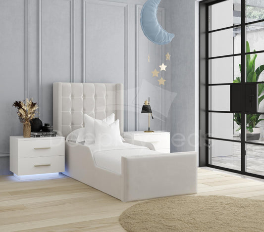 Modern bedroom with a white bed, nightstands, and decorative elements.