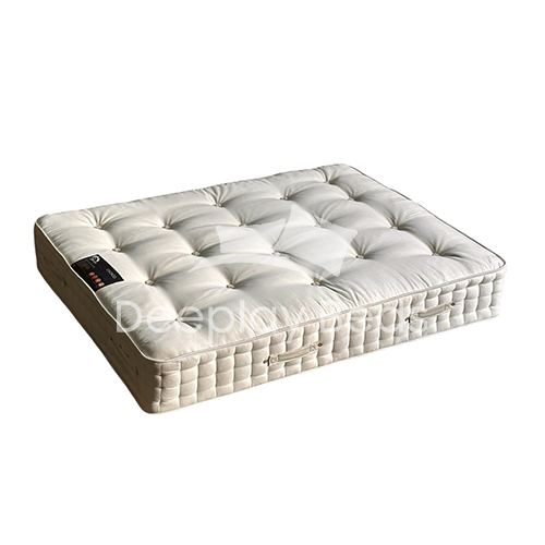 White mattress with a control panel on a white background