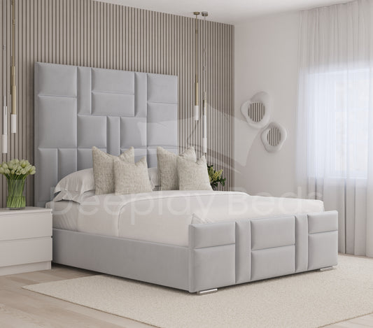 Gray upholstered bed in a modern bedroom with decorative pillows and a headboard.