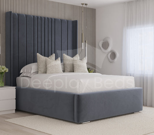 Chelsea blue wingback upholstered ottoman bed frame with tall panelled headboard in modern bedroom.